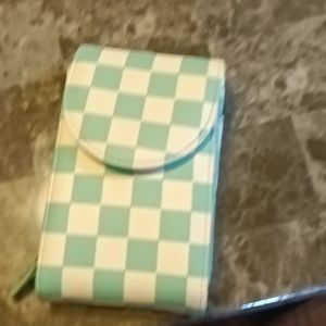 A checkerd wallet 1ft and white and teal